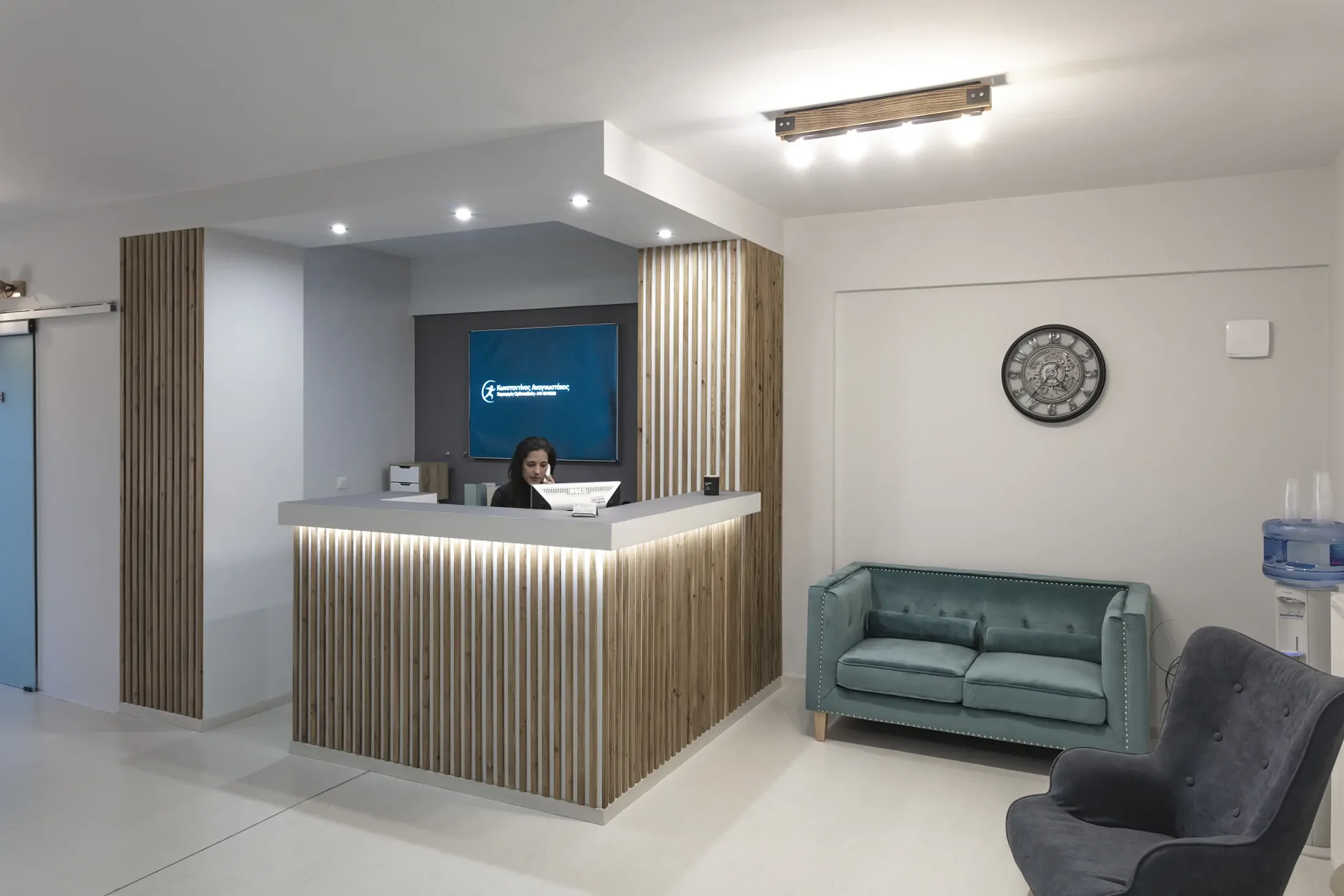 Finished orthopedic clinic reception with timber cladding and lighting